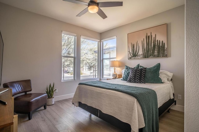 bedroom featuring ceiling fan and wood-type flooring