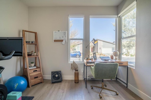 office with light hardwood / wood-style flooring