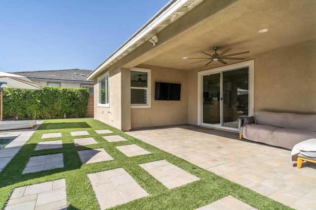 view of patio / terrace featuring ceiling fan