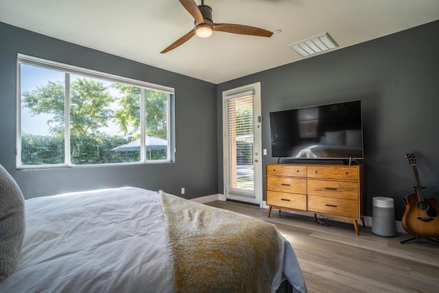 bedroom featuring hardwood / wood-style flooring and ceiling fan