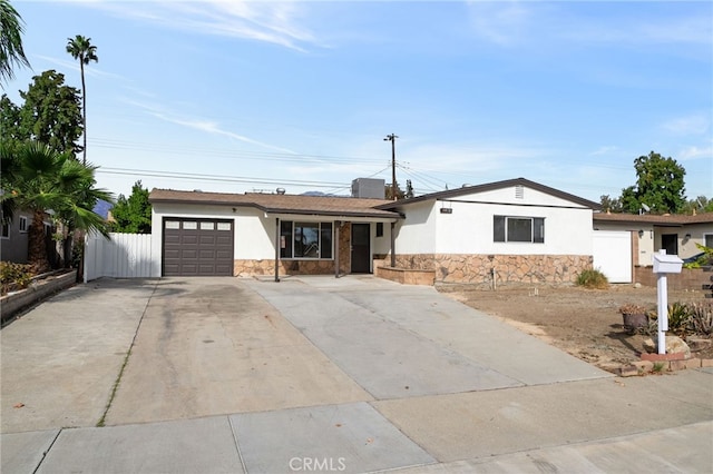 ranch-style home featuring a garage