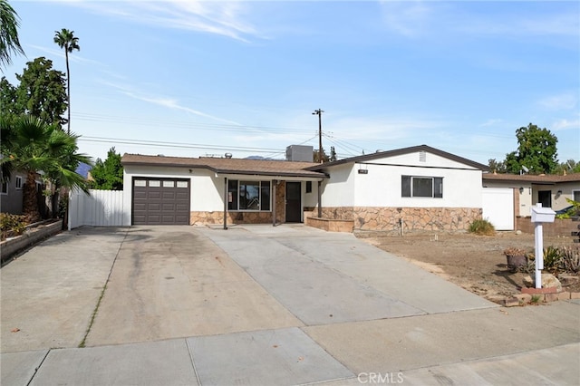 ranch-style house featuring a garage