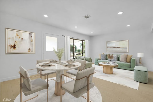 dining area with light wood-type flooring