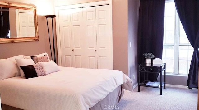 carpeted bedroom featuring a closet