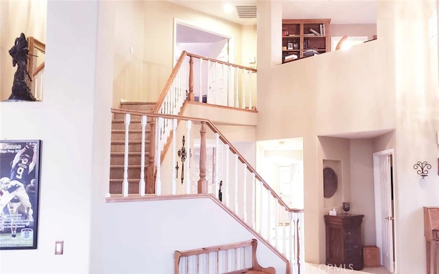 stairway with a towering ceiling