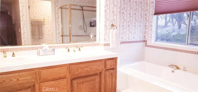 bathroom featuring separate shower and tub and vanity