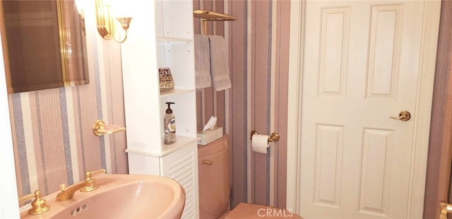1793 Sutliff Rd, San Miguel, CA 93451 - half bathroom with wallpapered walls and a sink