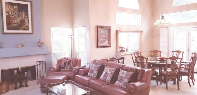 living room with plenty of natural light and a high ceiling