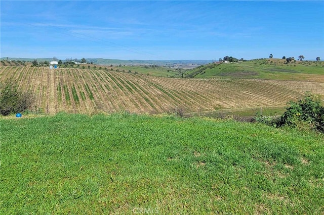 mountain view featuring a rural view