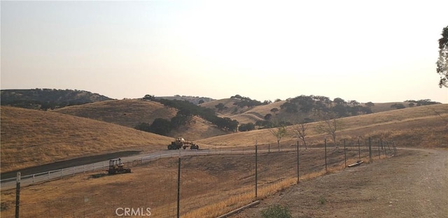 view of yard featuring a mountain view and a rural view