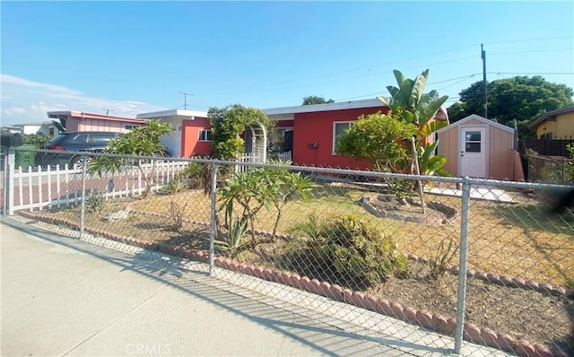 single story home with a shed