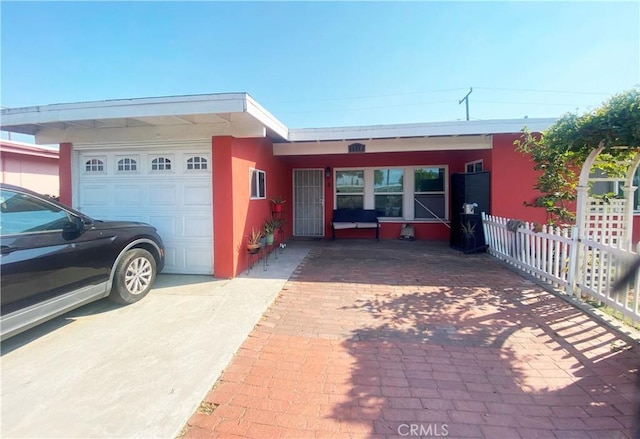 ranch-style home featuring a garage