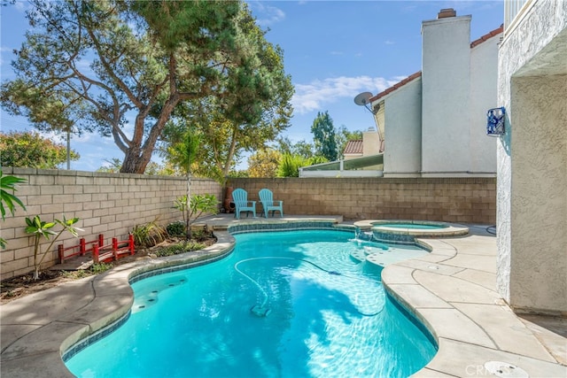 view of swimming pool featuring an in ground hot tub