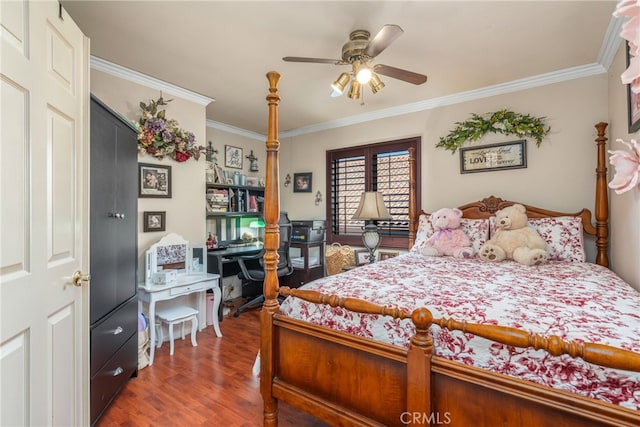 bedroom with crown molding, ceiling fan, and dark hardwood / wood-style flooring