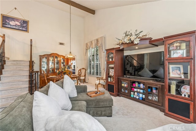 living room featuring high vaulted ceiling, carpet, and beamed ceiling