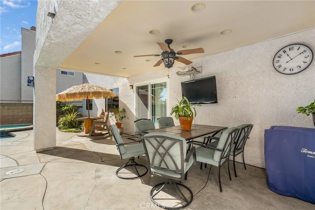 view of patio / terrace featuring a gazebo and ceiling fan