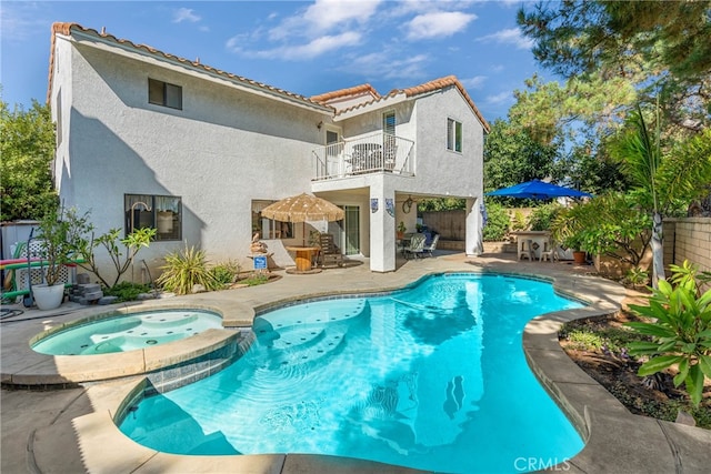 view of pool featuring an in ground hot tub and a patio area