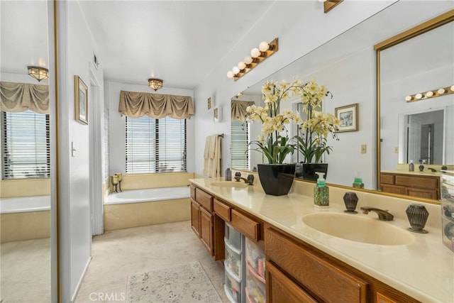 bathroom featuring vanity and a relaxing tiled tub