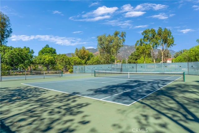 view of sport court with a mountain view