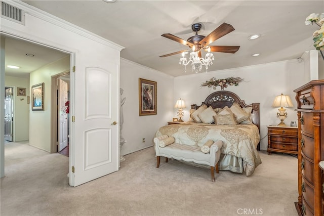 carpeted bedroom with ornamental molding and ceiling fan