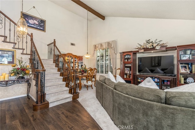 living room featuring hardwood / wood-style floors, beam ceiling, high vaulted ceiling, and a chandelier