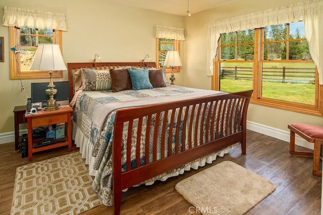 bedroom with hardwood / wood-style floors