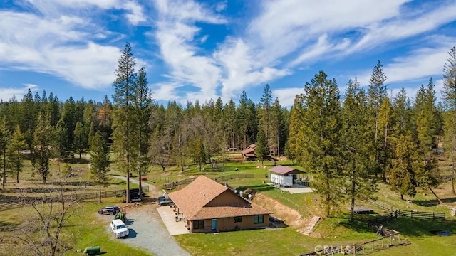 birds eye view of property with a rural view