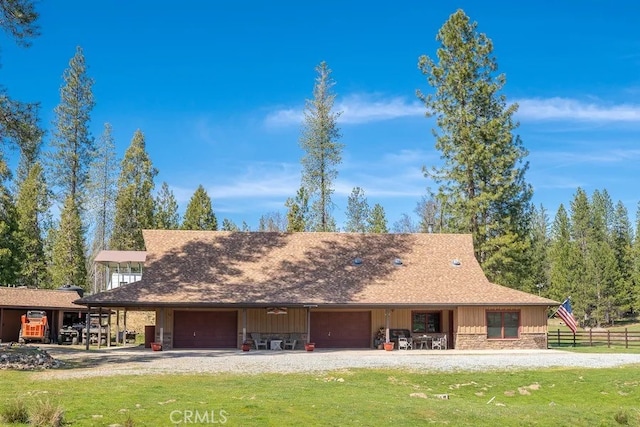 view of front of property with a front yard and a carport