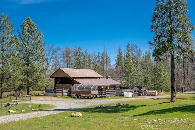 view of community featuring an outbuilding