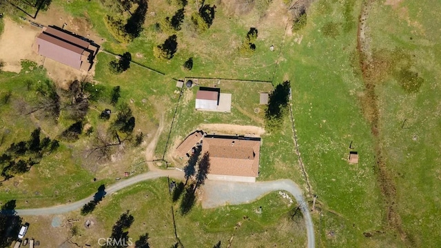 birds eye view of property featuring a rural view