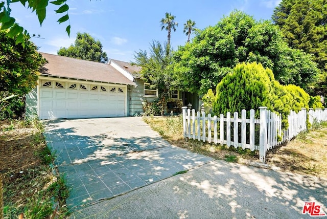 view of front of property with a garage