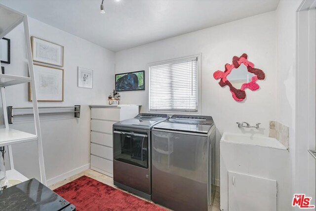 clothes washing area with independent washer and dryer