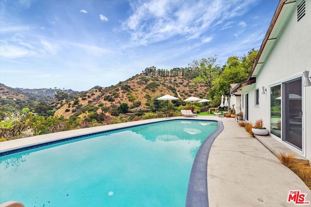 view of pool with a mountain view