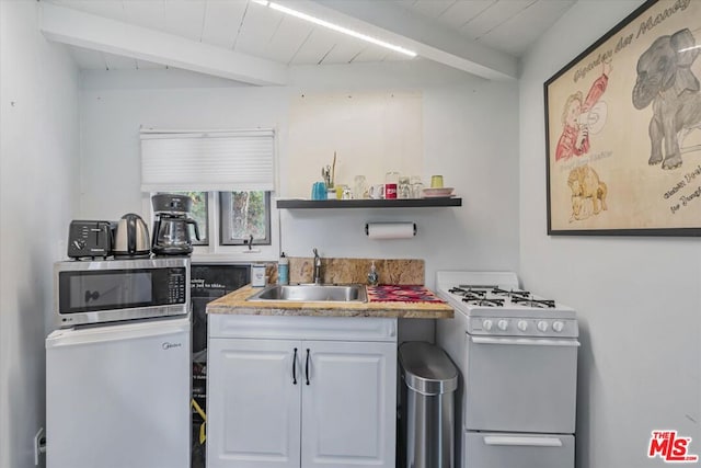 kitchen with white cabinets, sink, white gas range, beam ceiling, and wood ceiling