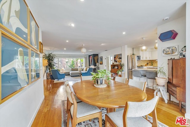 dining room with light hardwood / wood-style floors