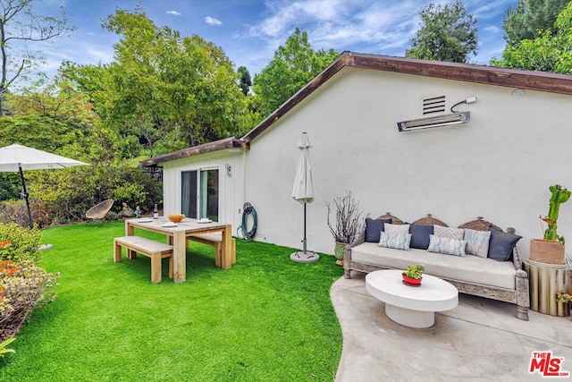 back of house featuring an outdoor hangout area, a yard, and a patio