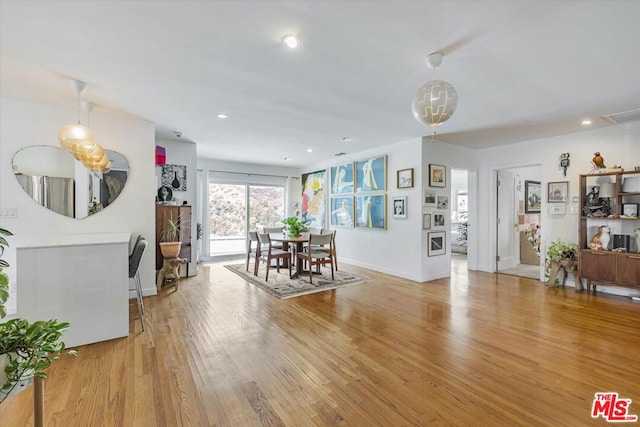 dining area with light wood-type flooring