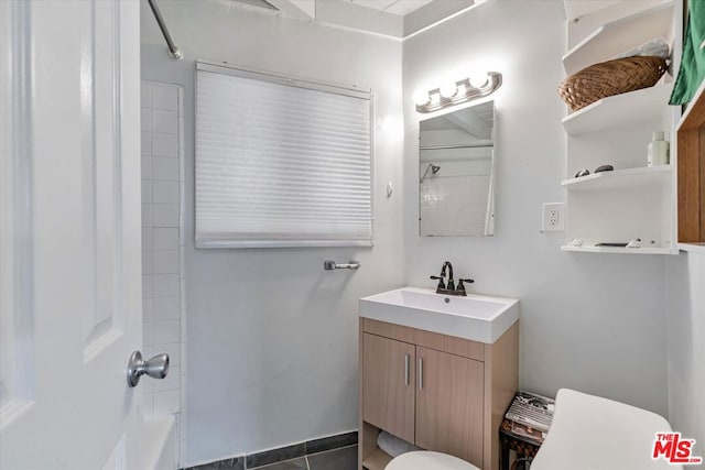 full bathroom featuring tile patterned flooring, vanity, shower / bathtub combination, and toilet