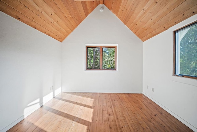 bonus room featuring vaulted ceiling, wooden ceiling, and light hardwood / wood-style floors