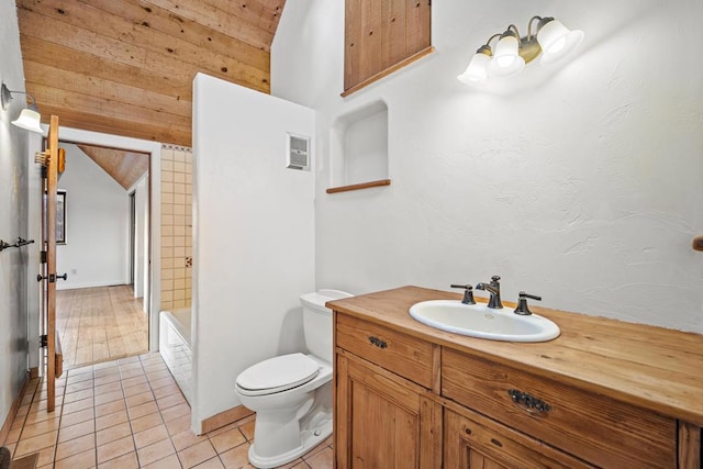 bathroom featuring toilet, vanity, and tile patterned floors