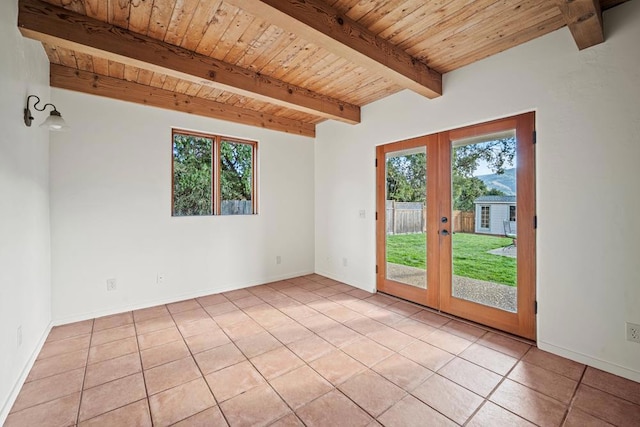 empty room with light tile patterned floors, wood ceiling, french doors, and beamed ceiling