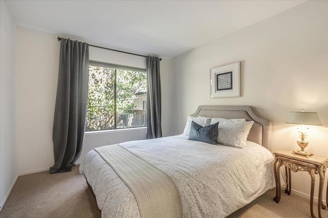 bedroom with light colored carpet