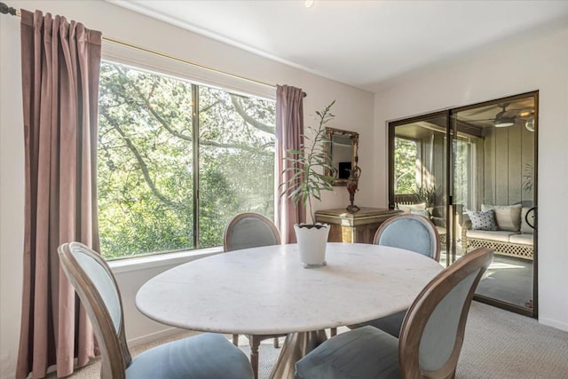 view of carpeted dining space