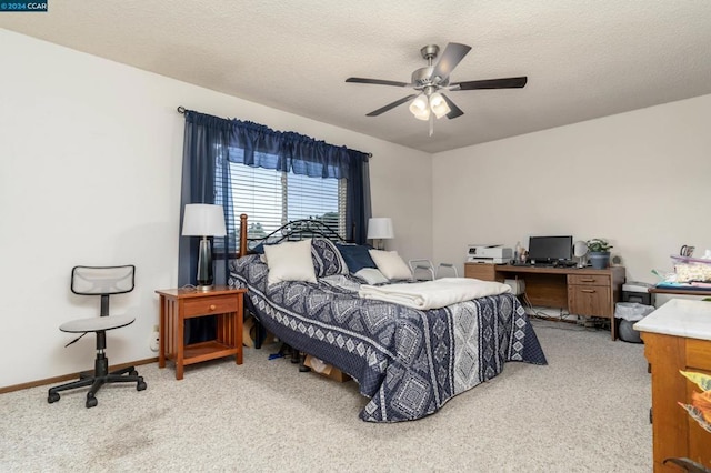 bedroom with light carpet, ceiling fan, and a textured ceiling