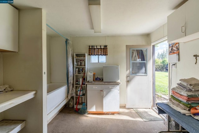 interior space featuring light colored carpet