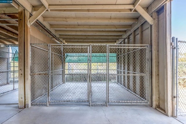 view of gate featuring an outdoor structure