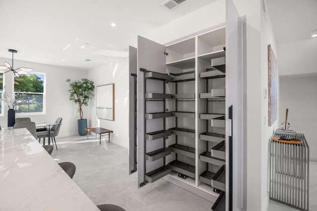 office featuring an inviting chandelier