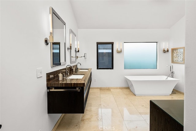 bathroom with a bathtub and vanity