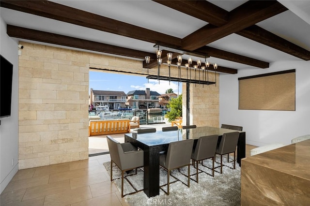 dining space featuring beamed ceiling, a notable chandelier, and light tile patterned flooring