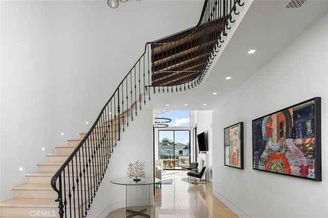 stairway with a high ceiling